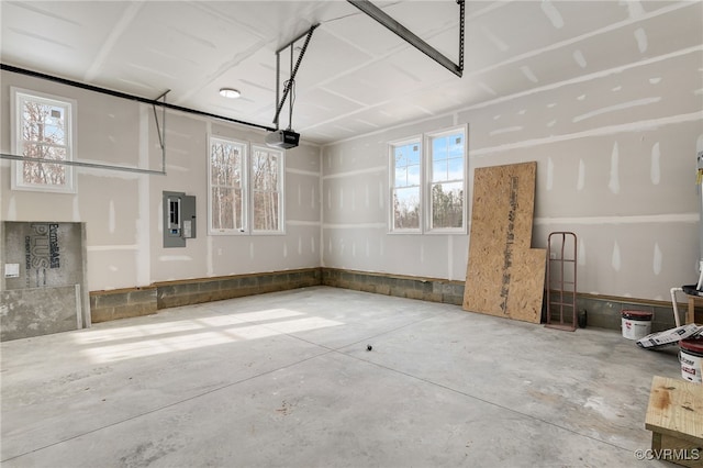 garage featuring electric panel and a garage door opener