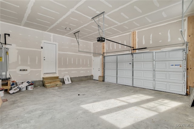 garage with water heater and a garage door opener