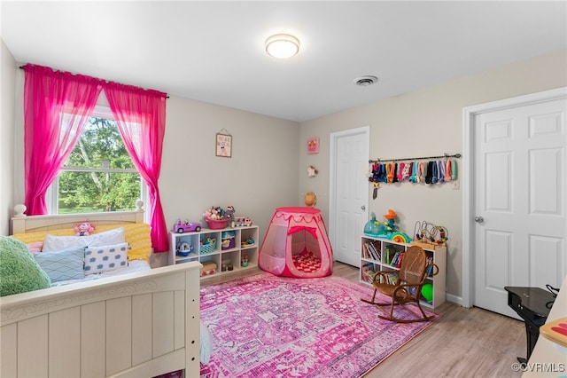 bedroom featuring hardwood / wood-style flooring