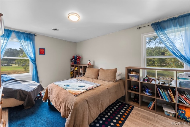 bedroom featuring hardwood / wood-style flooring