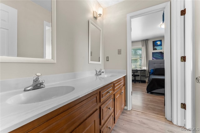 bathroom featuring vanity and hardwood / wood-style flooring