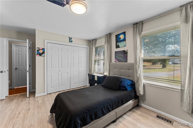 bedroom featuring a closet and light hardwood / wood-style floors