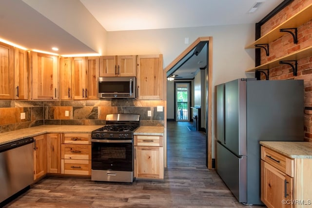 kitchen featuring light brown cabinets, decorative backsplash, dark hardwood / wood-style floors, and stainless steel appliances