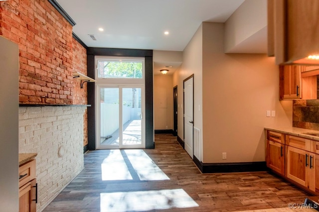 doorway with dark hardwood / wood-style flooring