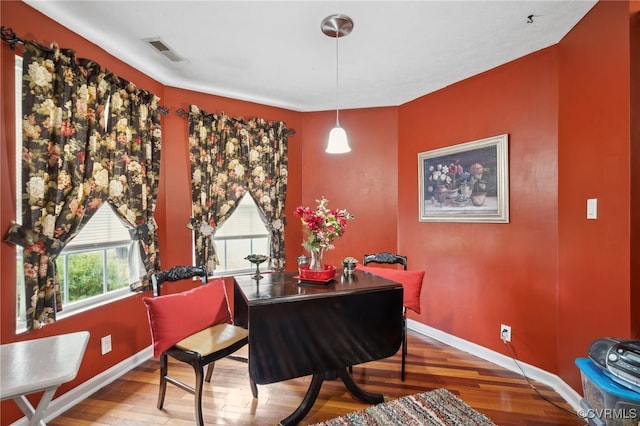 dining space featuring wood-type flooring