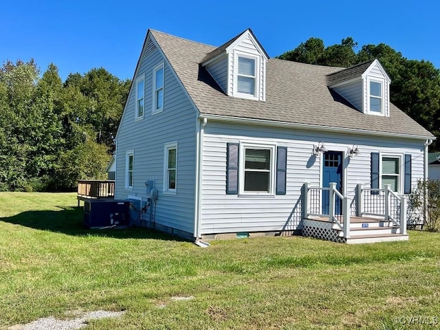 cape cod house featuring central air condition unit, a front yard, and a deck