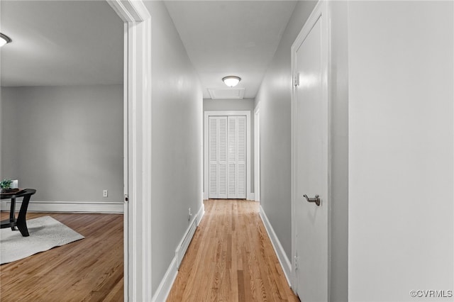 corridor featuring light hardwood / wood-style floors