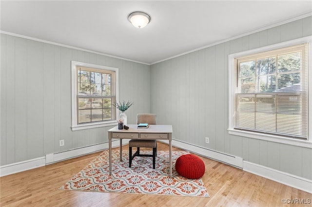 office area featuring hardwood / wood-style flooring, baseboard heating, and a wealth of natural light