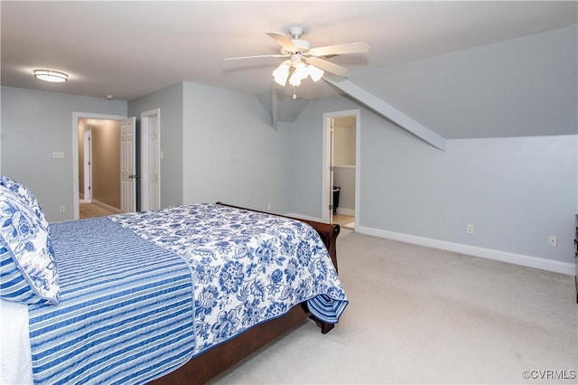 carpeted bedroom featuring lofted ceiling, a ceiling fan, and baseboards