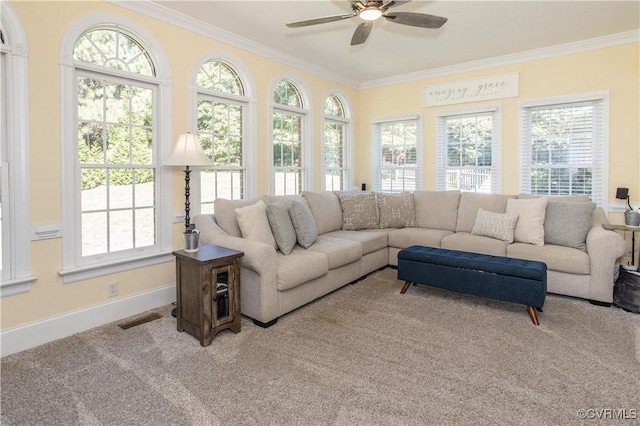 sunroom / solarium with a ceiling fan, visible vents, and plenty of natural light