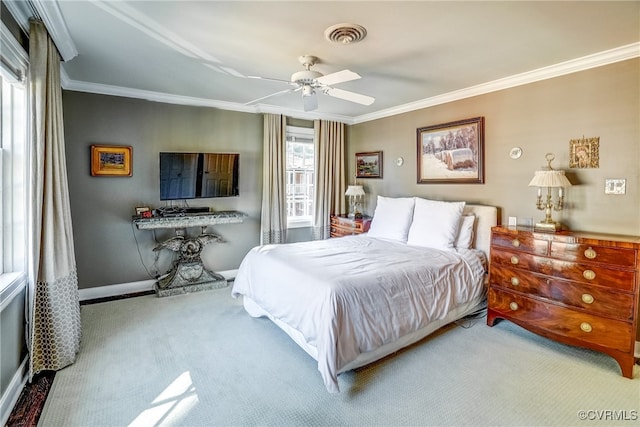 bedroom with carpet, ceiling fan, and ornamental molding