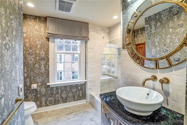 bathroom with vanity and toilet