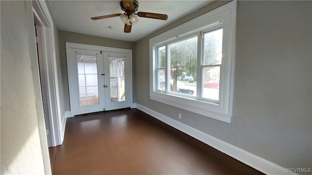 entryway with ceiling fan and french doors