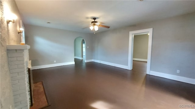 unfurnished living room with ceiling fan