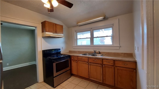 kitchen with lofted ceiling, sink, ceiling fan, light tile patterned floors, and black / electric stove