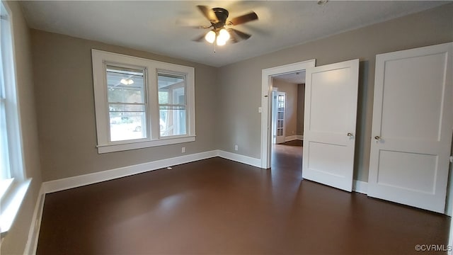 unfurnished room with ceiling fan