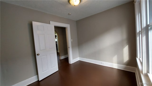 empty room featuring a textured ceiling