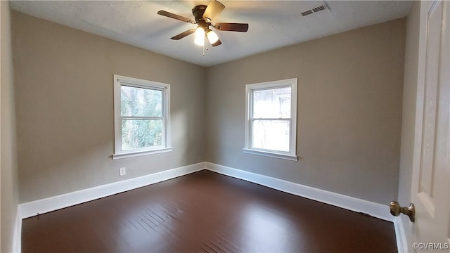 spare room featuring ceiling fan and hardwood / wood-style floors