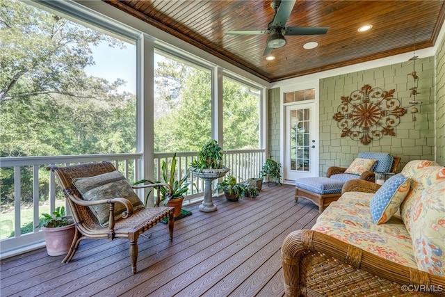 sunroom with wooden ceiling and ceiling fan