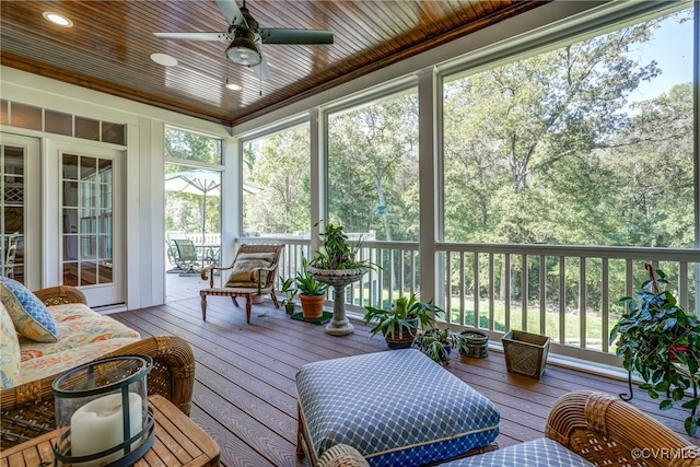 sunroom / solarium featuring ceiling fan and plenty of natural light