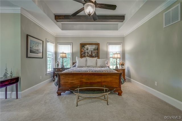 carpeted bedroom with beamed ceiling, ceiling fan, and crown molding