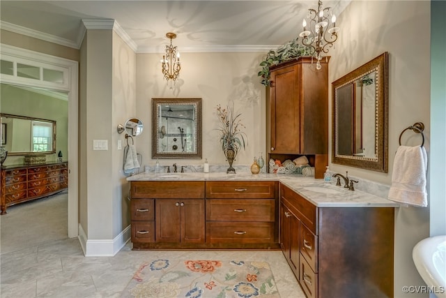 bathroom featuring ornamental molding, an inviting chandelier, and vanity