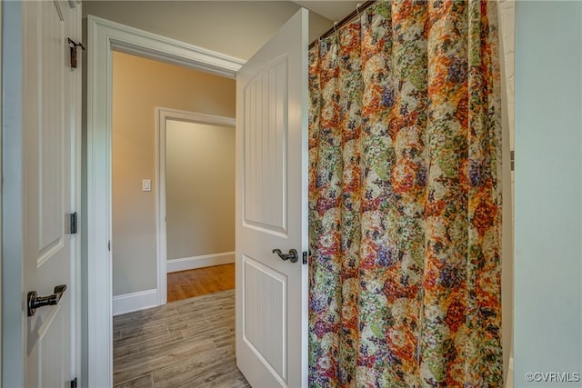 bathroom with hardwood / wood-style floors