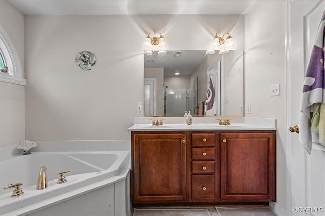 bathroom featuring vanity and shower with separate bathtub