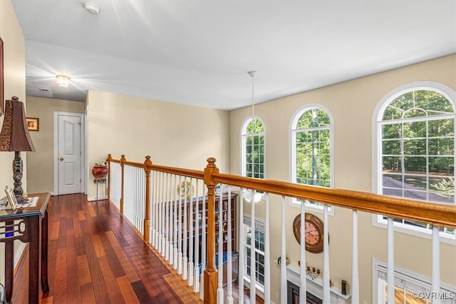 hallway with dark hardwood / wood-style floors