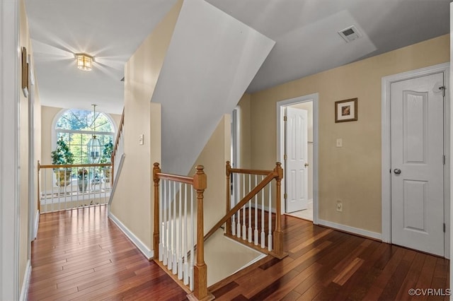 stairs with hardwood / wood-style floors