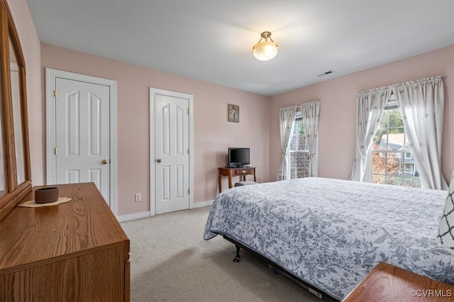 bedroom with light carpet