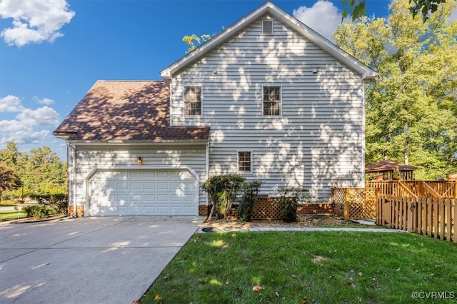 view of side of home featuring a garage