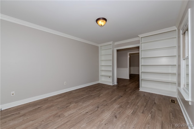 unfurnished bedroom featuring wood-type flooring and crown molding