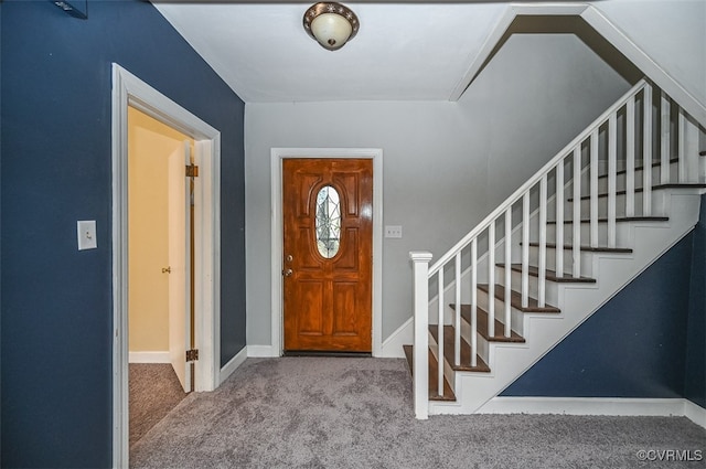 foyer with light colored carpet