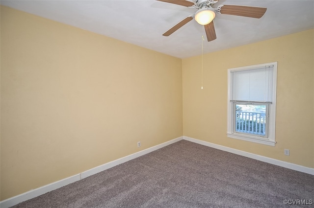 carpeted empty room featuring ceiling fan