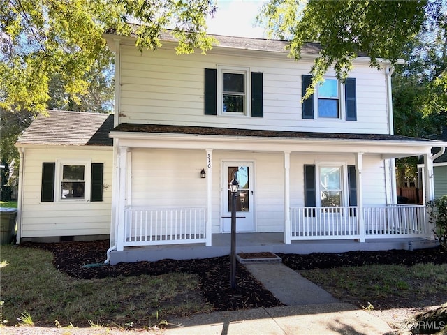 view of front facade featuring a garage and covered porch