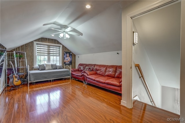 bedroom featuring ceiling fan, hardwood / wood-style floors, and vaulted ceiling