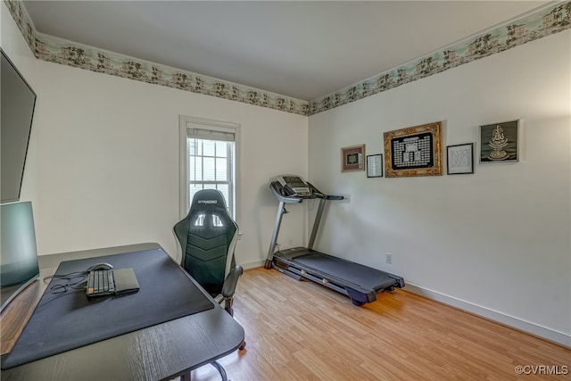 exercise area featuring hardwood / wood-style flooring