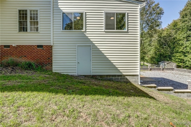 rear view of property featuring a yard