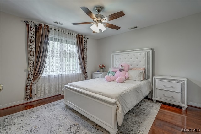 bedroom featuring wood-type flooring and ceiling fan