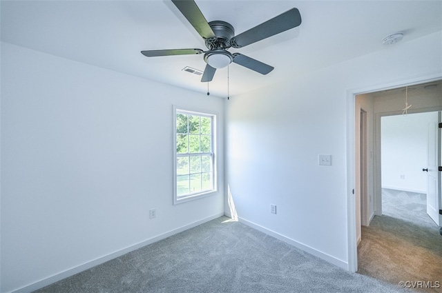 unfurnished room with carpet flooring and ceiling fan