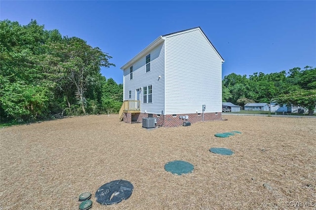 view of side of home featuring central air condition unit