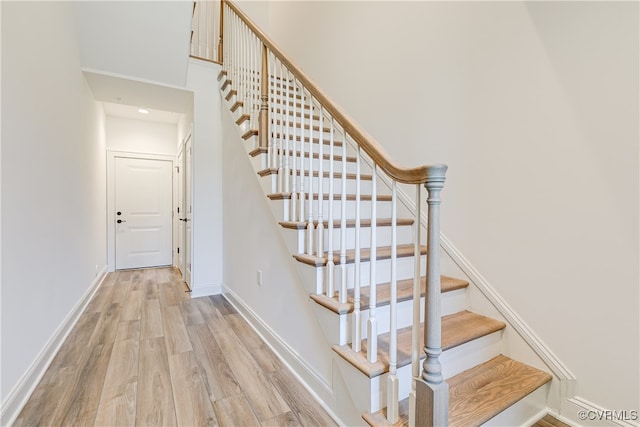 stairs with wood-type flooring