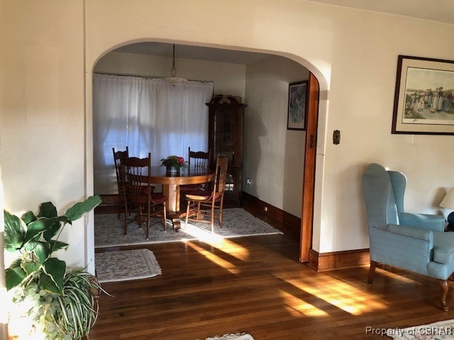 dining space with dark hardwood / wood-style floors