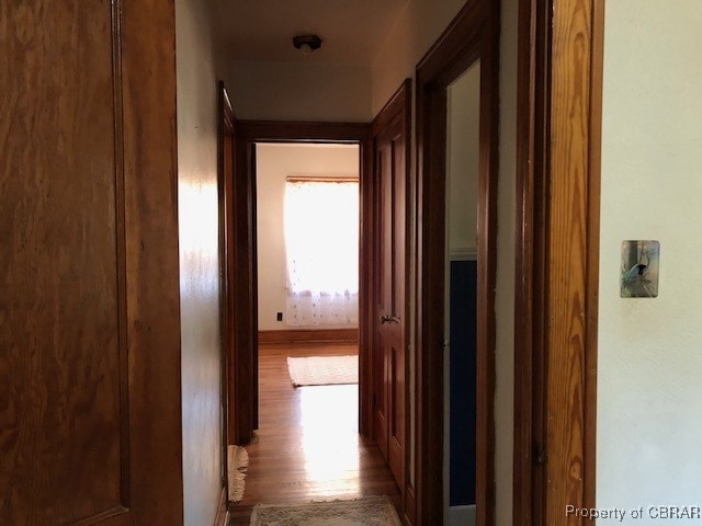 corridor featuring light hardwood / wood-style flooring