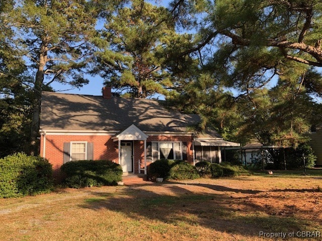 view of front of home with a front yard