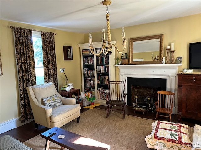 sitting room with dark hardwood / wood-style flooring