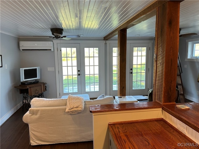 interior space featuring dark wood-type flooring, plenty of natural light, french doors, and a wall mounted AC