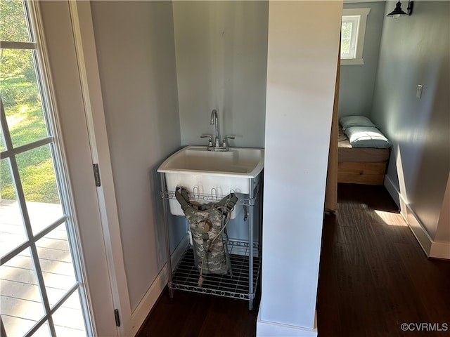 bathroom featuring sink and hardwood / wood-style floors