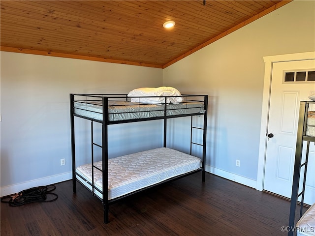 unfurnished bedroom featuring wood ceiling, dark wood-type flooring, vaulted ceiling, and crown molding